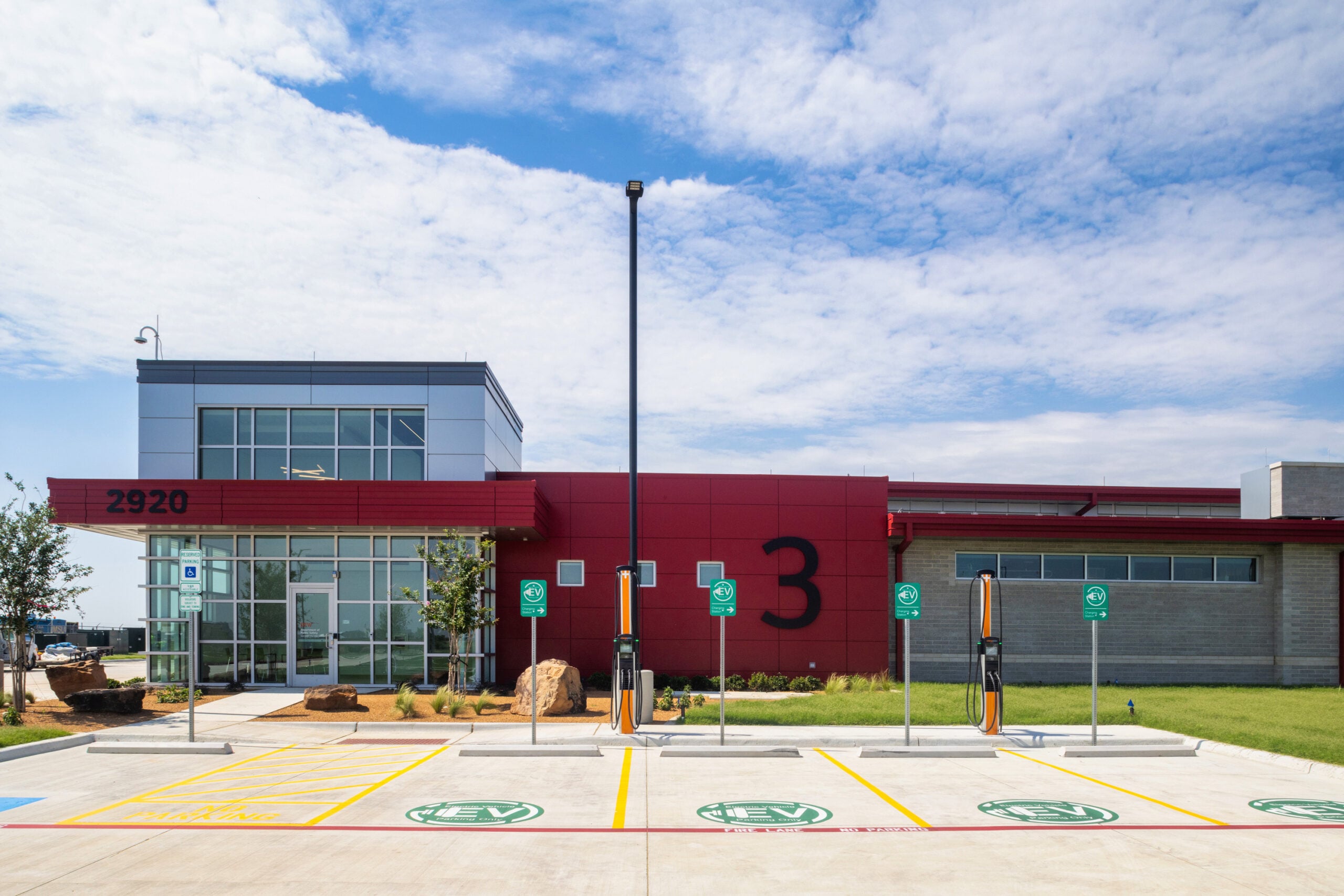 DFW Airport ARFF Station 3 exterior with EV charging stations and accessible parking
