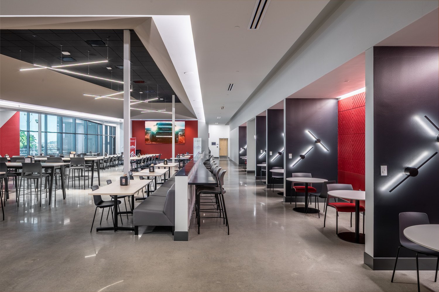 Photograph of the JAXPORT campus, which features 25,000 SF dedicated to amenities such as a fitness center, cafeteria (shown), outdoor gathering areas, locker rooms, and training spaces.