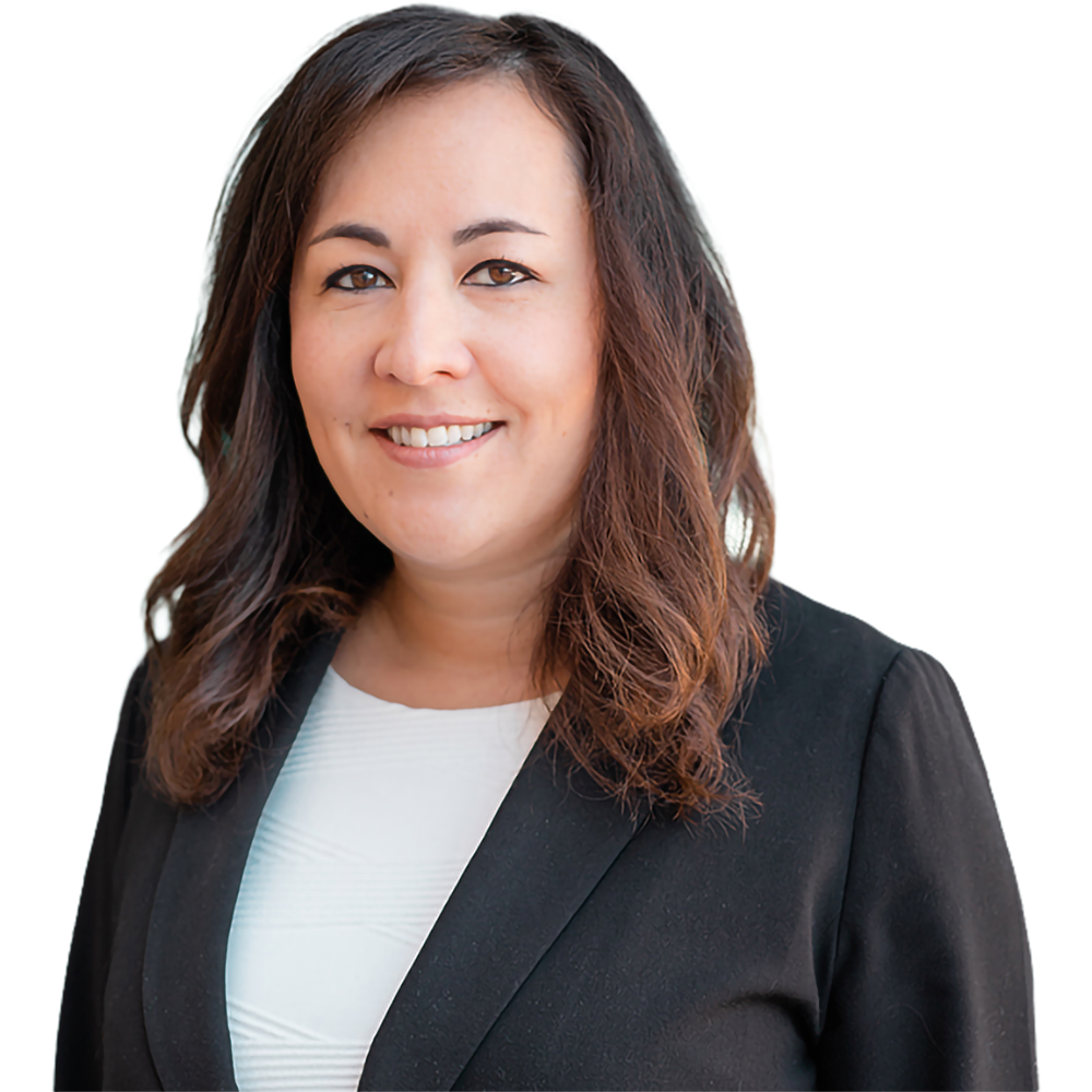 Smiling woman in a black blazer and white blouse, posing for a professional headshot.