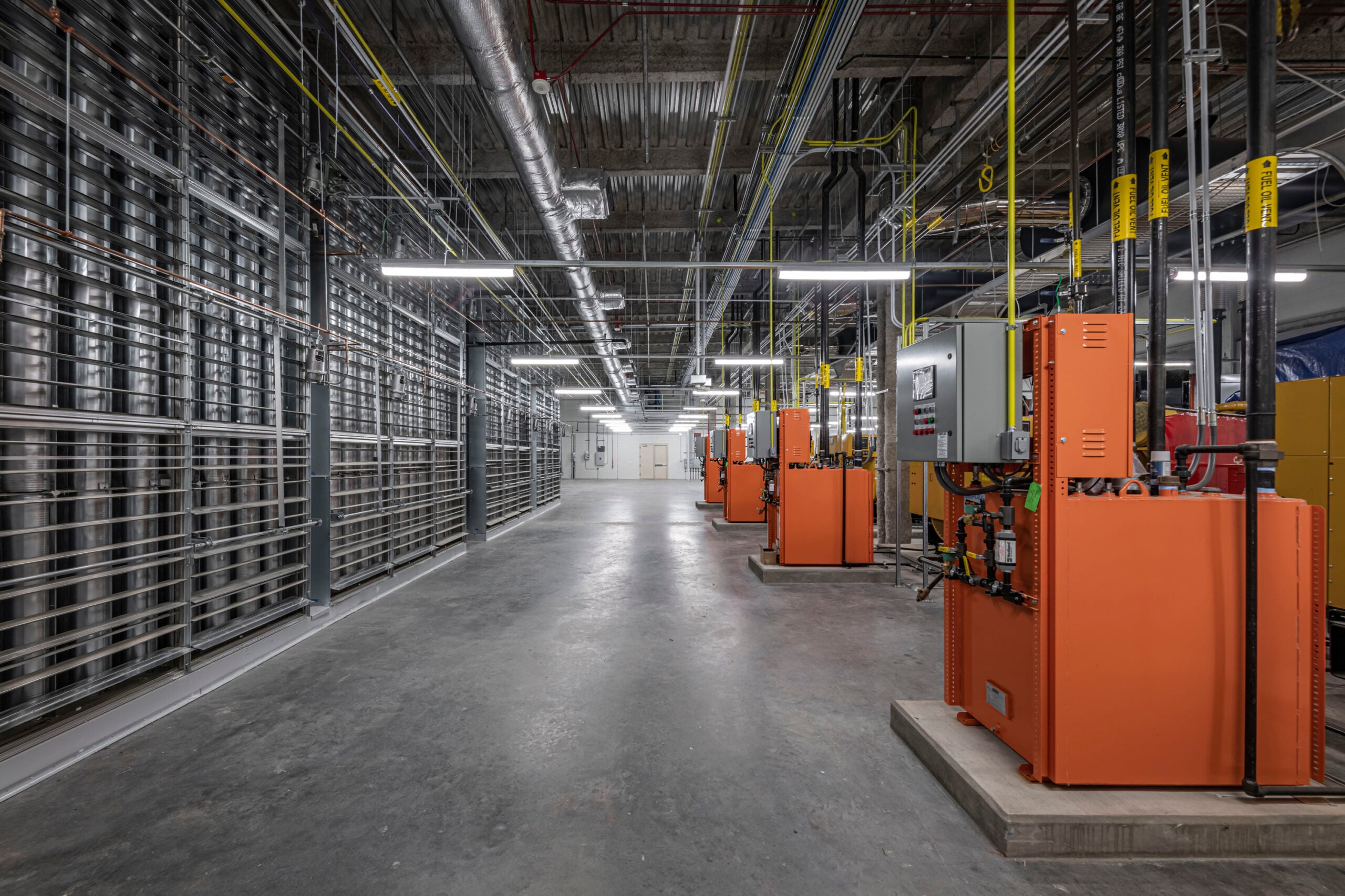 | JE Dunn Construction Industrial facility electrical infrastructure with power distribution equipment supporting energy-intensive operations.