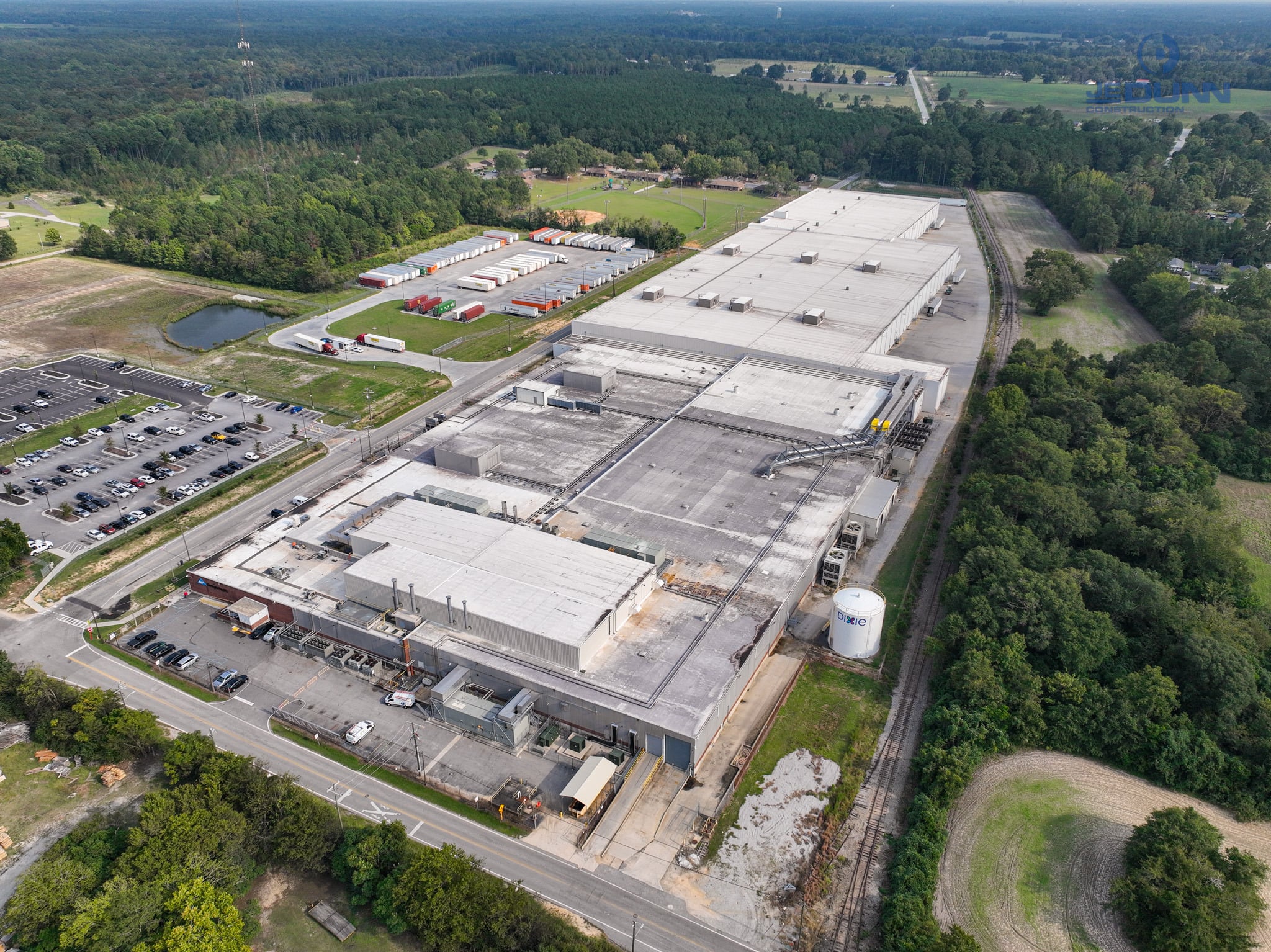 | JE Dunn Construction Aerial view of an industrial manufacturing campus where power capacity considerations influence site selection and future expansion.