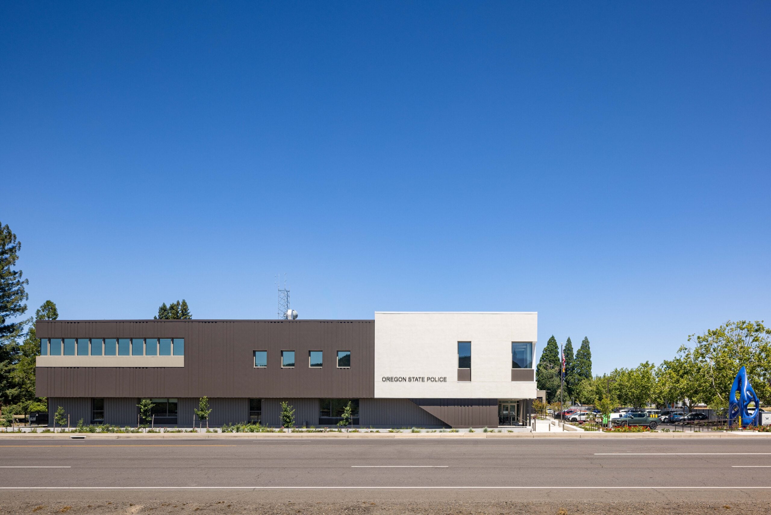 Front view of the Oregon State Police building under a clear blue sky.