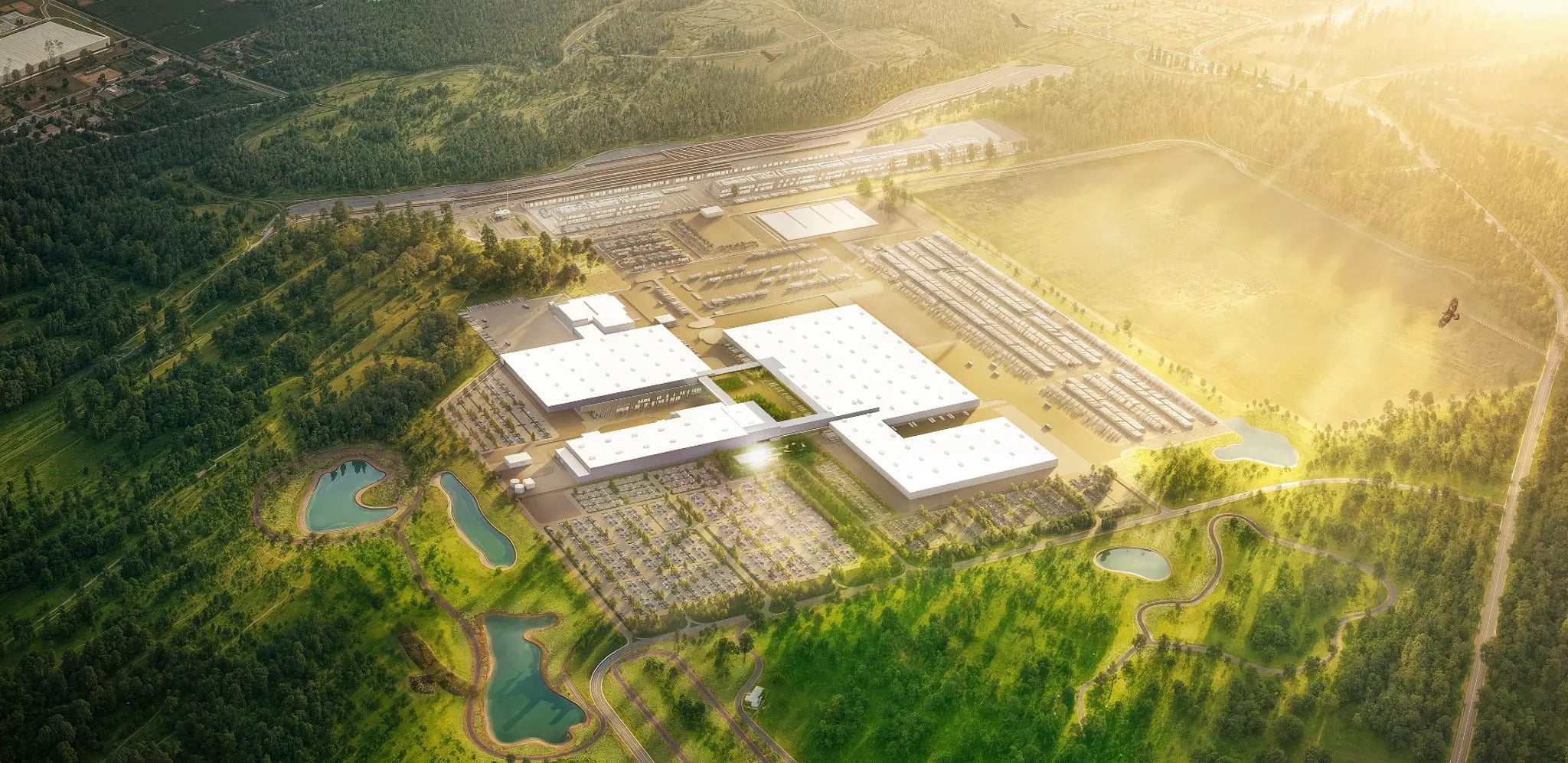 Aerial rendering of Rivian's 4.5-million-square-foot electric vehicle manufacturing campus in Stanton Springs, Georgia, showing production facilities, parking areas, and surrounding green space.