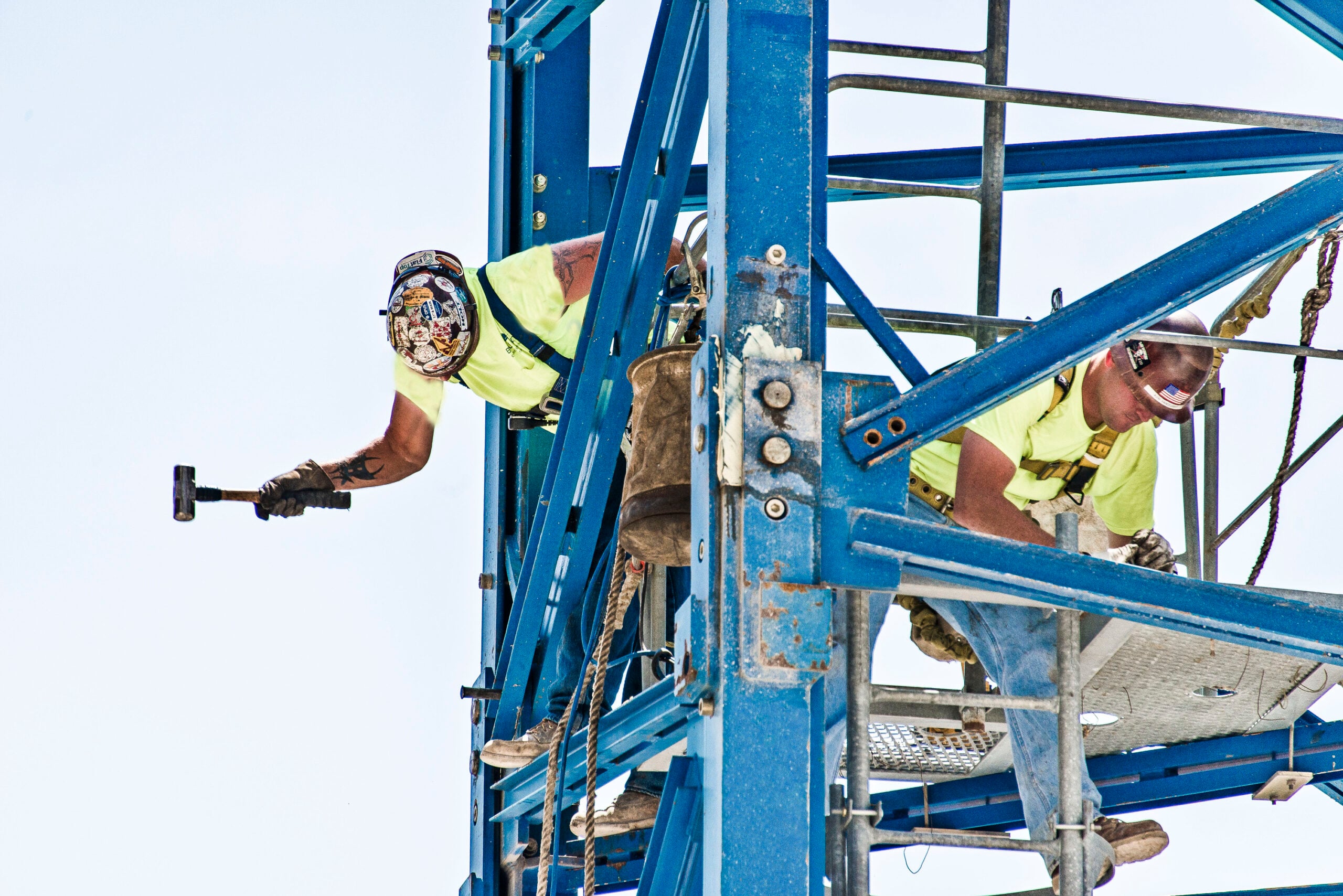 Construction workers assembling structural steel on an active construction project